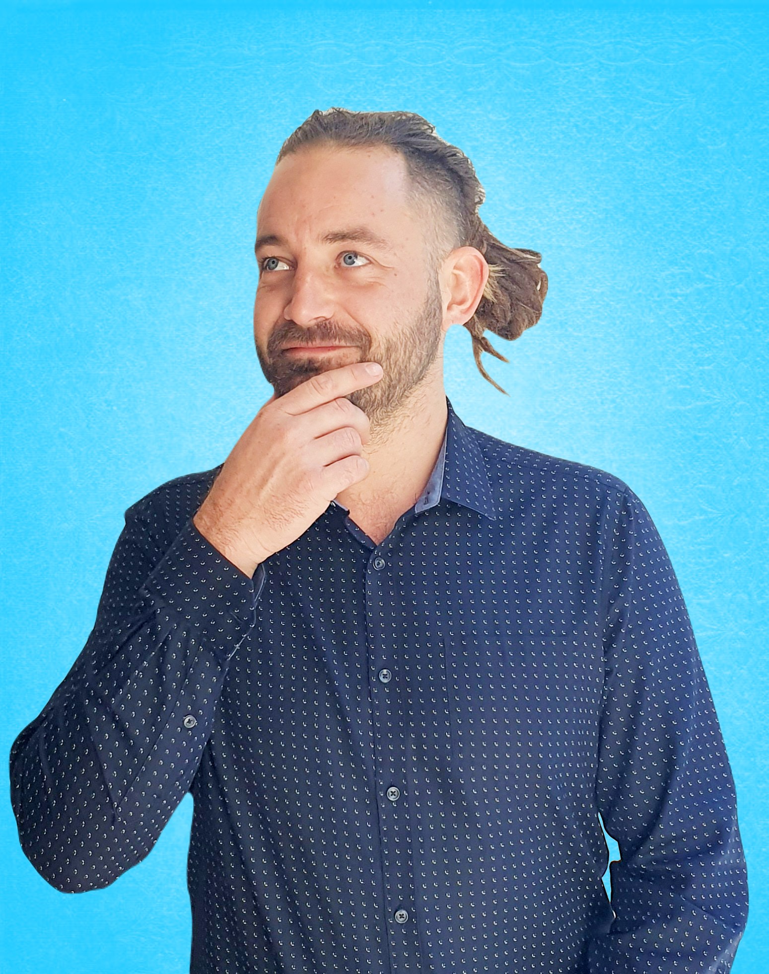 professional portrait of a man with a beard and black shirt